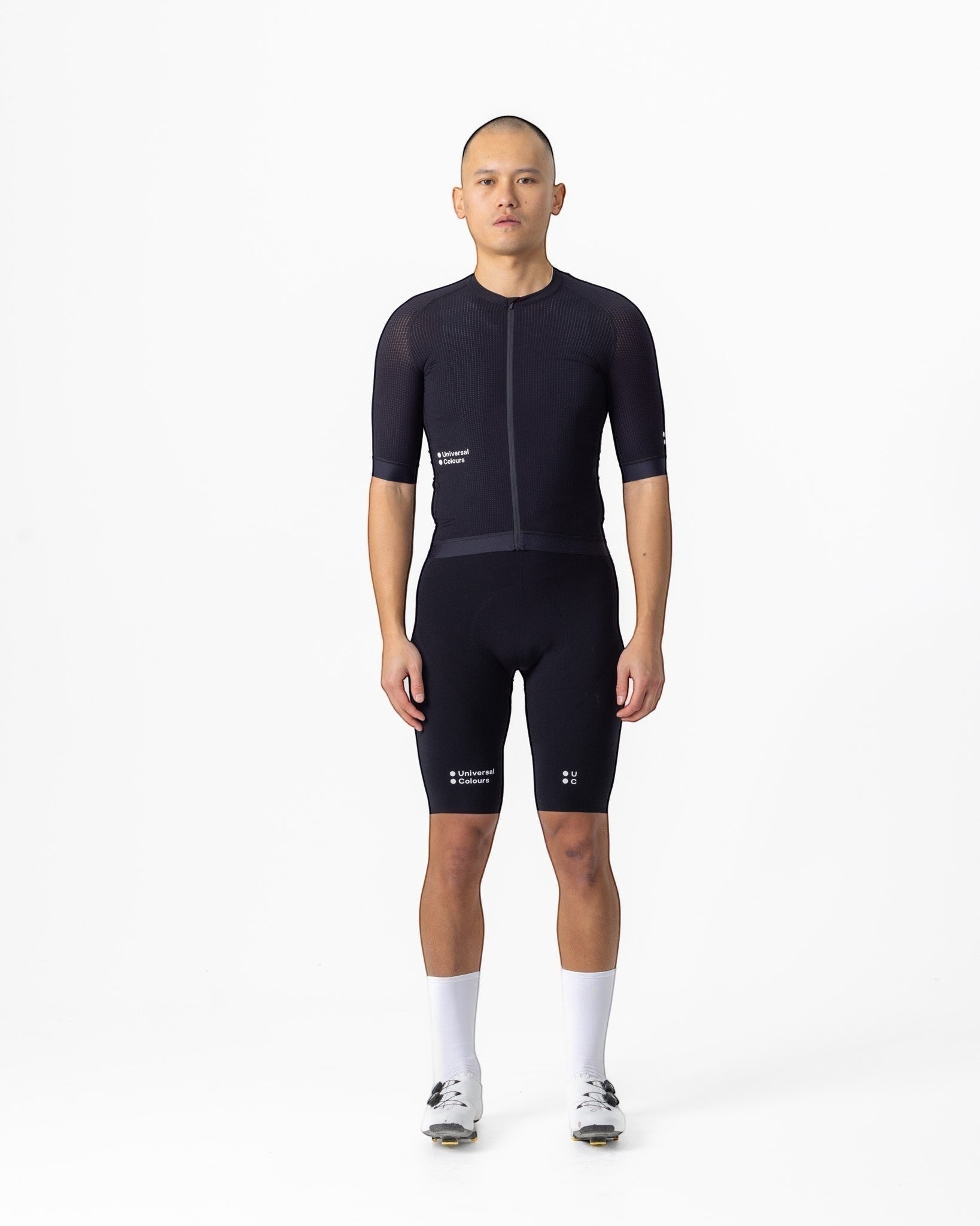 Moloko Cycling Ltd. men's black short sleeve cycling jersey made from French nylon with a cropped fit and raglan sleeves.