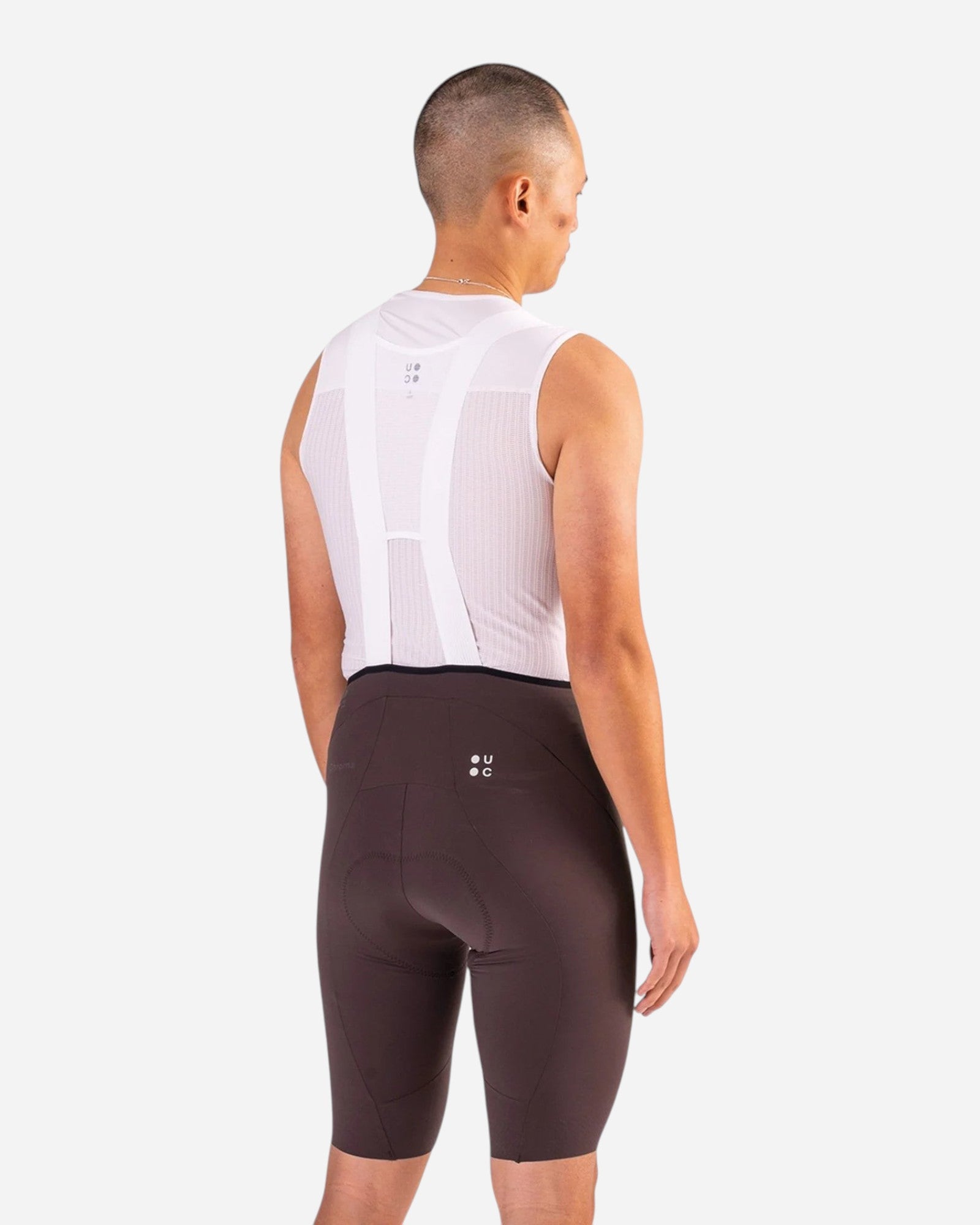 Moloko Cycling Ltd. men's dark brown nylon bib shorts with Elastic Interface pad and extended leg length.
