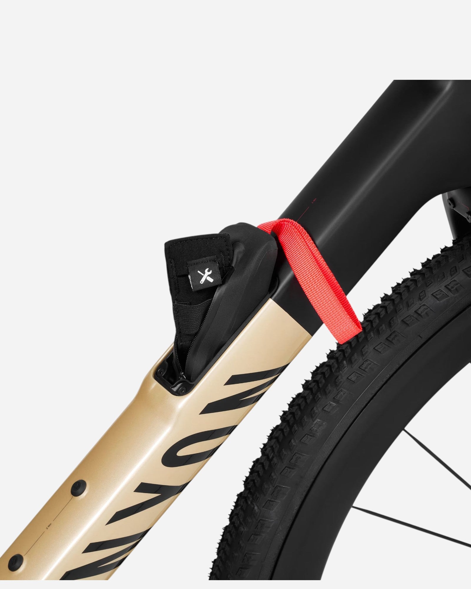 Moloko Cycling Ltd. gold gravel bike frame bag with red strap and tool icon