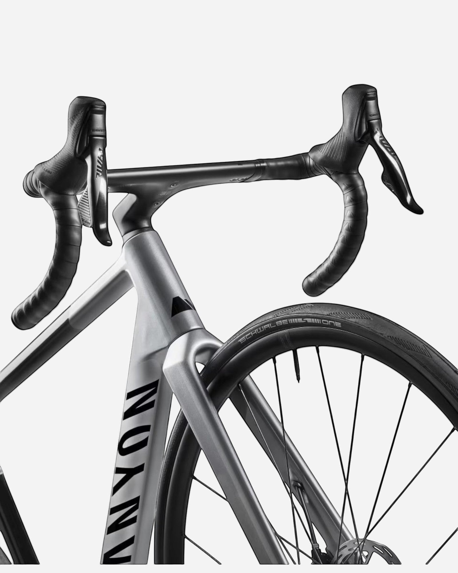 Moloko Cycling Ltd. grey carbon road bike with SRAM AXS electronic shifting and Schwalbe One tires.