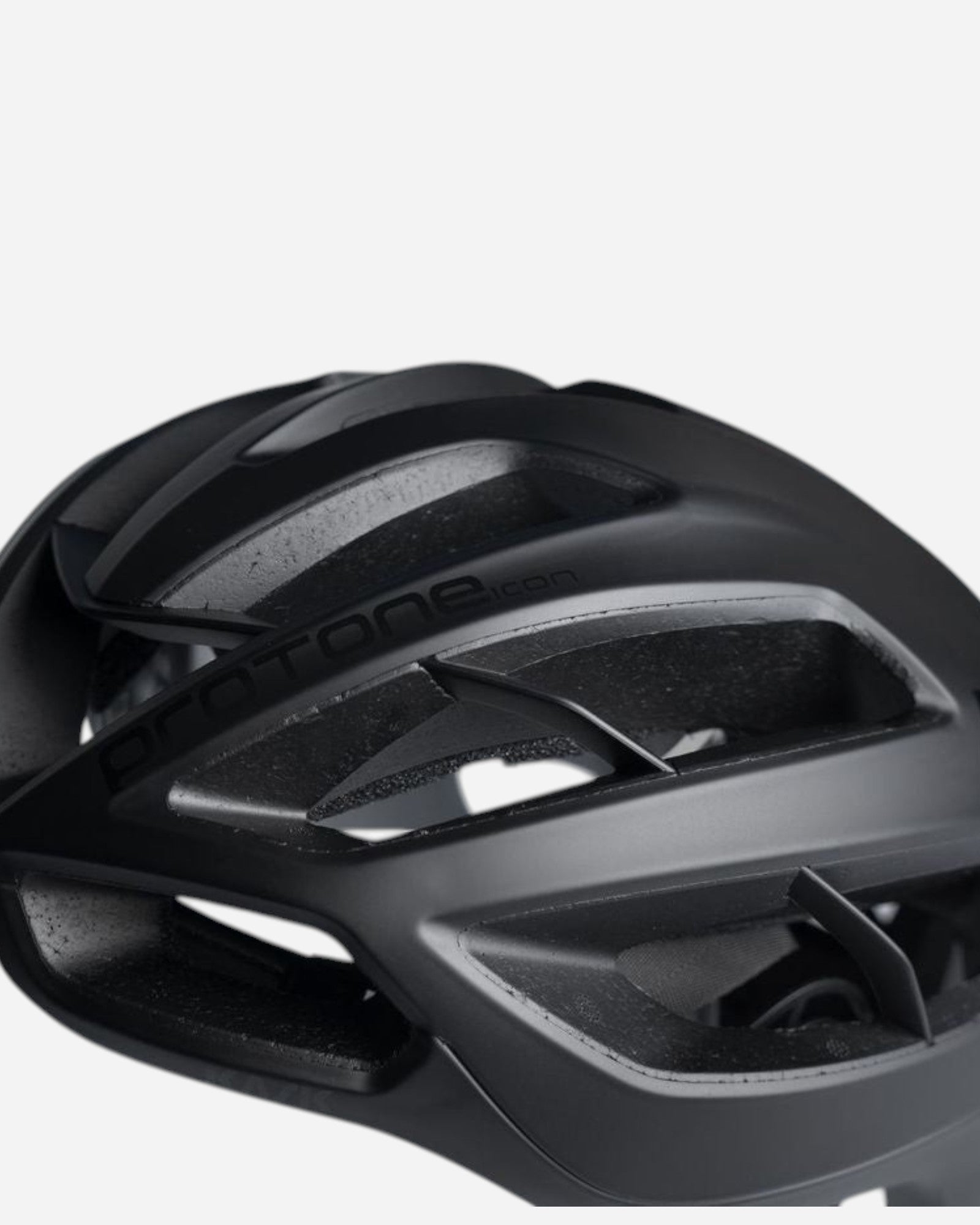 Moloko Cycling Ltd. Matt black Kask Protone Icon road cycling helmet with aerodynamic vents and internal padding.