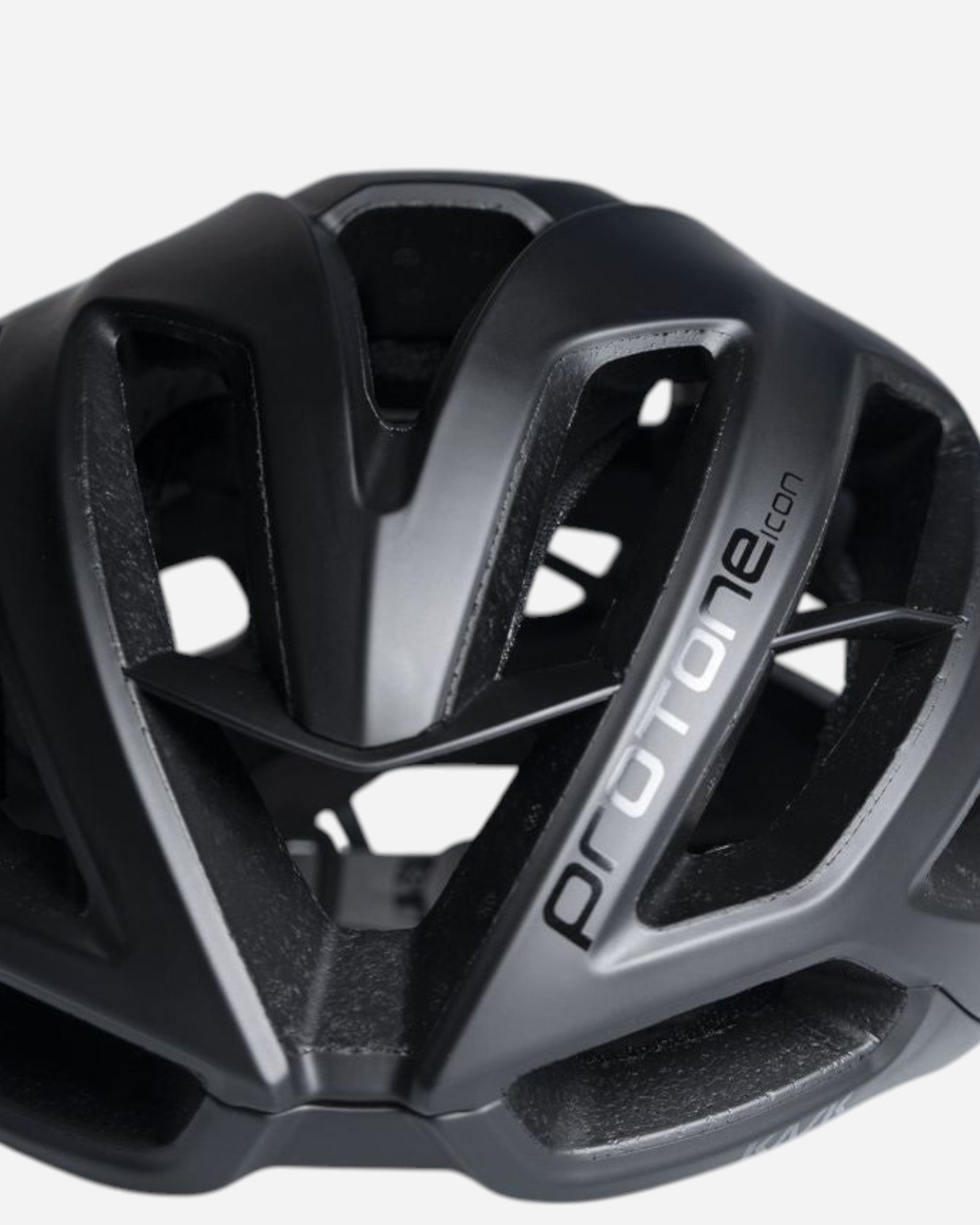 Moloko Cycling Ltd. Matt black Kask Protone Icon road cycling helmet with large vents and silver logo.