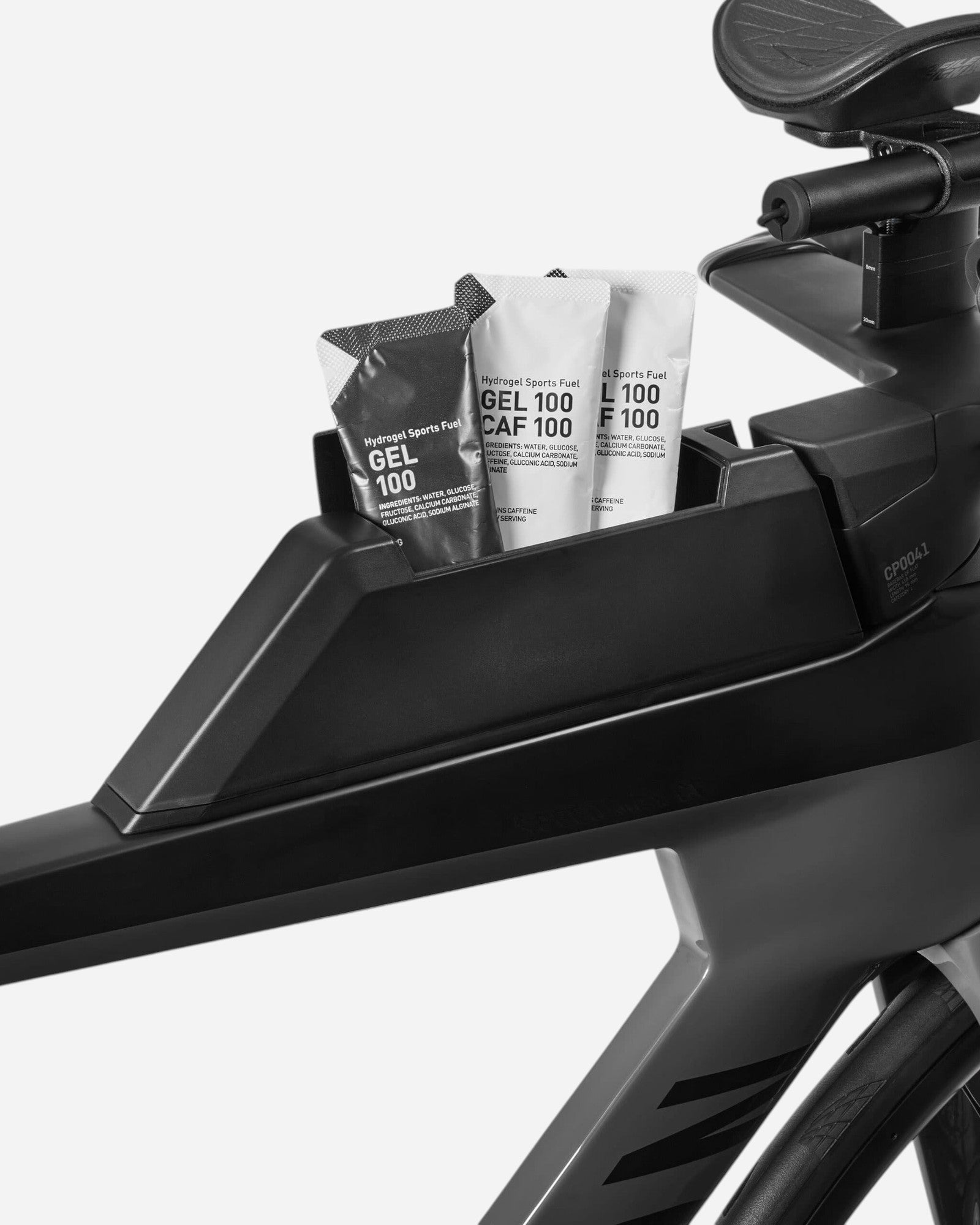 Moloko Cycling Ltd. Speedmax CF 7 triathlon bike frame with integrated storage holding three sports fuel gels.