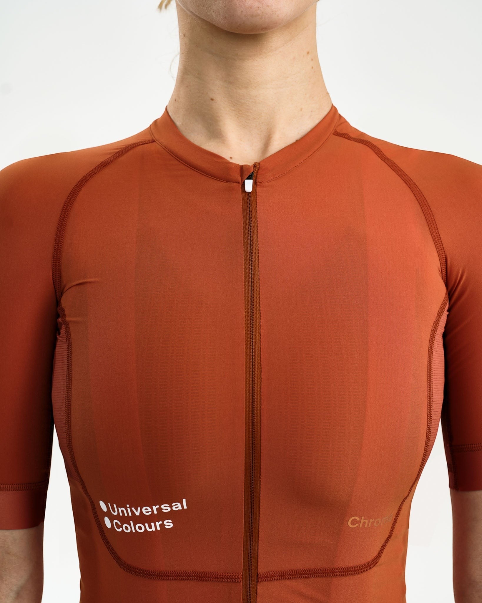 Moloko Cycling Ltd. women's short sleeve cycling jersey in Cyprus Copper. Made from recycled polyester with a matte finish and full zip.