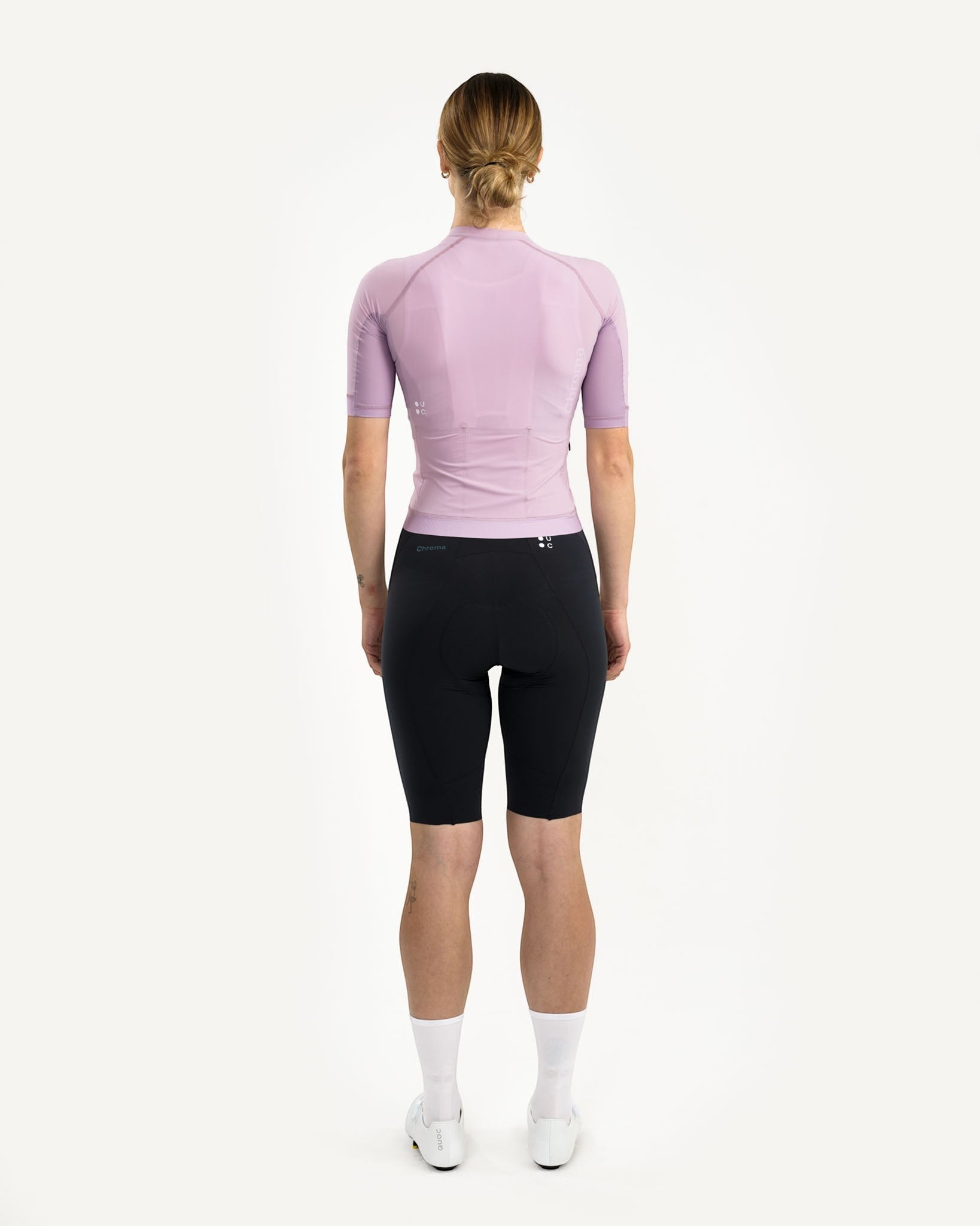 Moloko Cycling Ltd. women's washed lilac short sleeve cycling jersey made from recycled polyester and Italian woven fabric, featuring a tailored fit and three rear pockets.